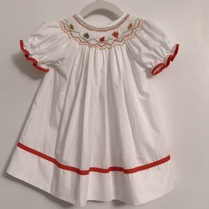 12 month Fall / Halloween Dress - Best Dressed Child brand. White orange smocked